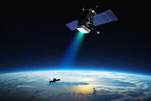 Space-Power-Laser-Beaming-Satellite-Concept | Space Power Satellite with solar panels releasing a blue-green engine plume above Earth's curved horizon.